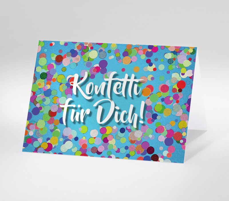 Konfetti auf blauem Hintergrund mit dem Schriftzug Konfetti für Dich!