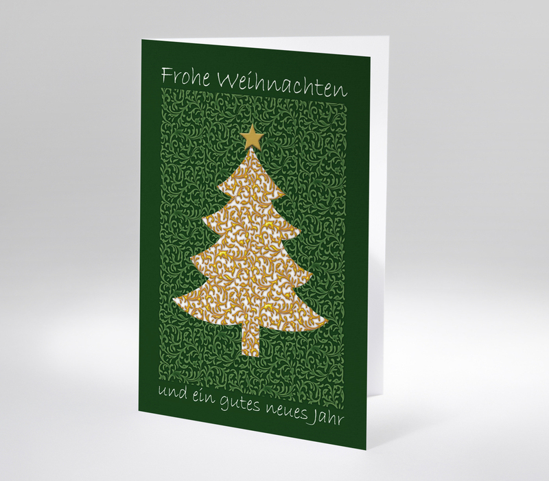 Weihnachtskarte mit weißem Tannenbaum auf grünem Hintergrund und goldenen Ornamenten