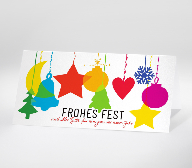 Bunte Weihnachtsmotive wie Sterne, Herzen und Glocken mit dem Schriftzug Frohes Fest