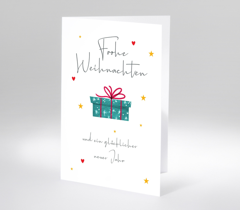 Illustration mit Geschenkpaket und handgeschriebenem Frohe-Weihnachten-Gruß