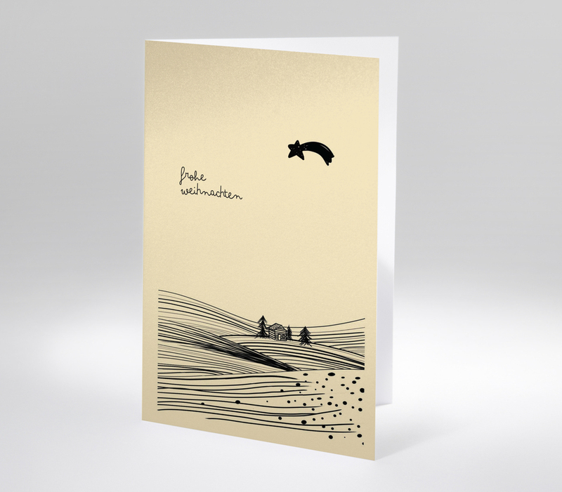 Minimalistische Weihnachtskarte mit schwarzer Landschaft, kleiner Hütte und Sternschnuppe auf beigem Hintergrund