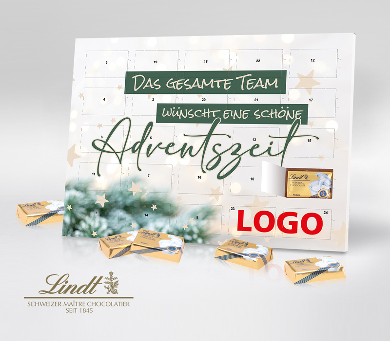 Tisch-Adventskalender von Lindt mit dem grünen Schriftzug das gesamte Team wünscht eine schöne Adventszeit vor hellem Hintergrund mit kleinen Sternen und einem Tannenzweig in der unteren linken Ecke.