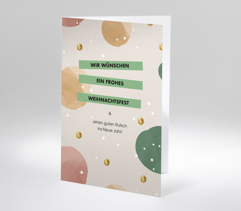 Weihnachtskarte mit abstrakten Kreisen und Text Wir wünschen ein frohes Weihnachtsfest und einen guten Rutsch ins neue Jahr